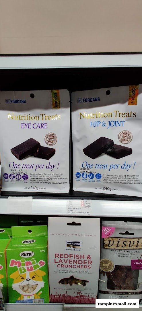 Various pet treats and nutritional supplements displayed on a shelf at Pet Lovers Centre.