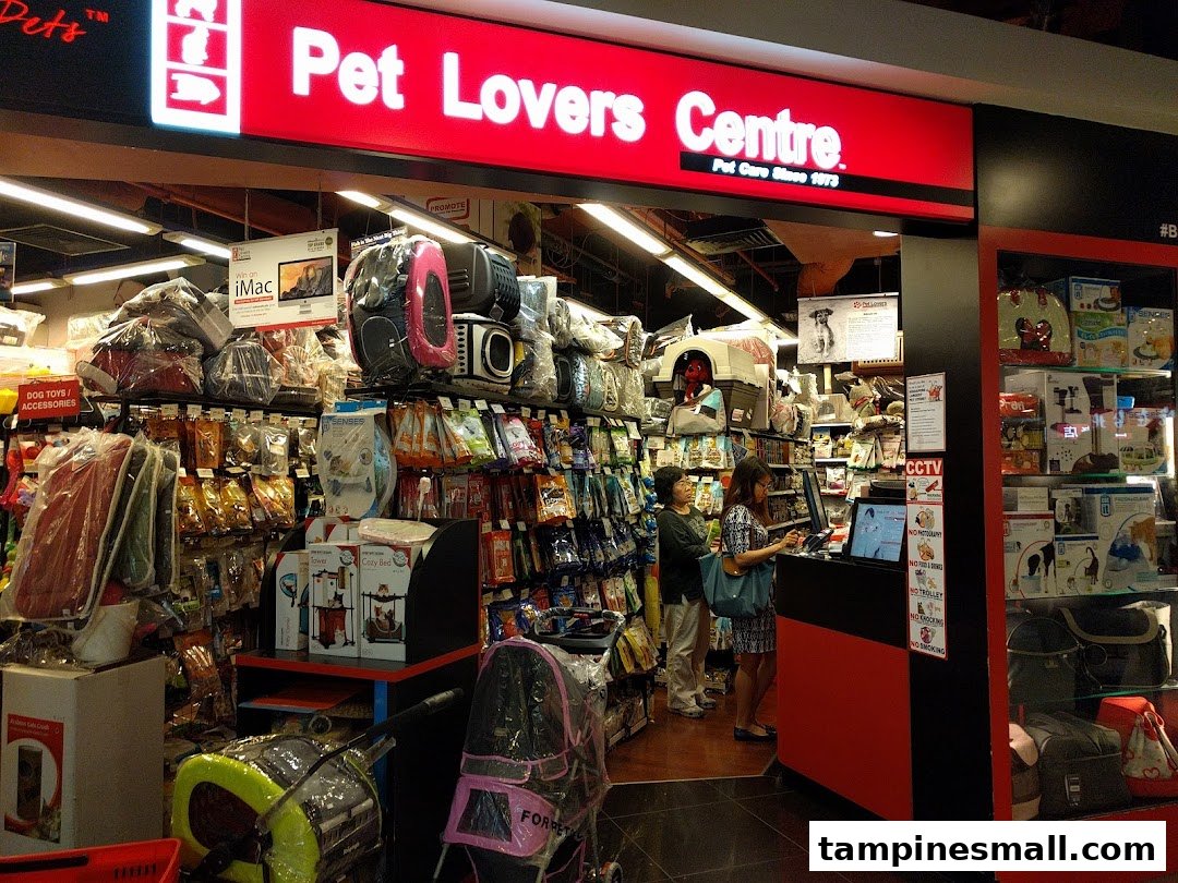 The vibrant red storefront of Pet Lovers Centre, showcasing a wide array of pet supplies and accessories.