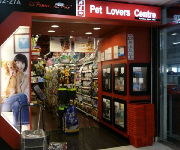 The entrance of Pet Lovers Centre, showcasing a wide array of pet supplies inside.