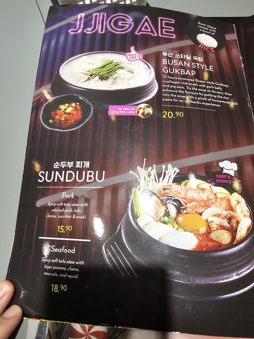 A menu page showcasing Korean jjigae and sundubu stews with detailed descriptions and prices.