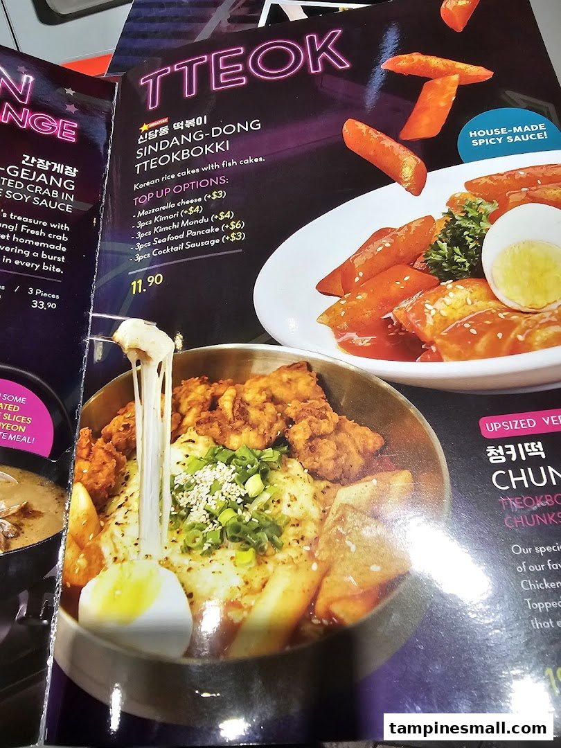 A vibrant menu page showcasing Korean Tteokbokki with various toppings and a cheesy fried chicken dish.