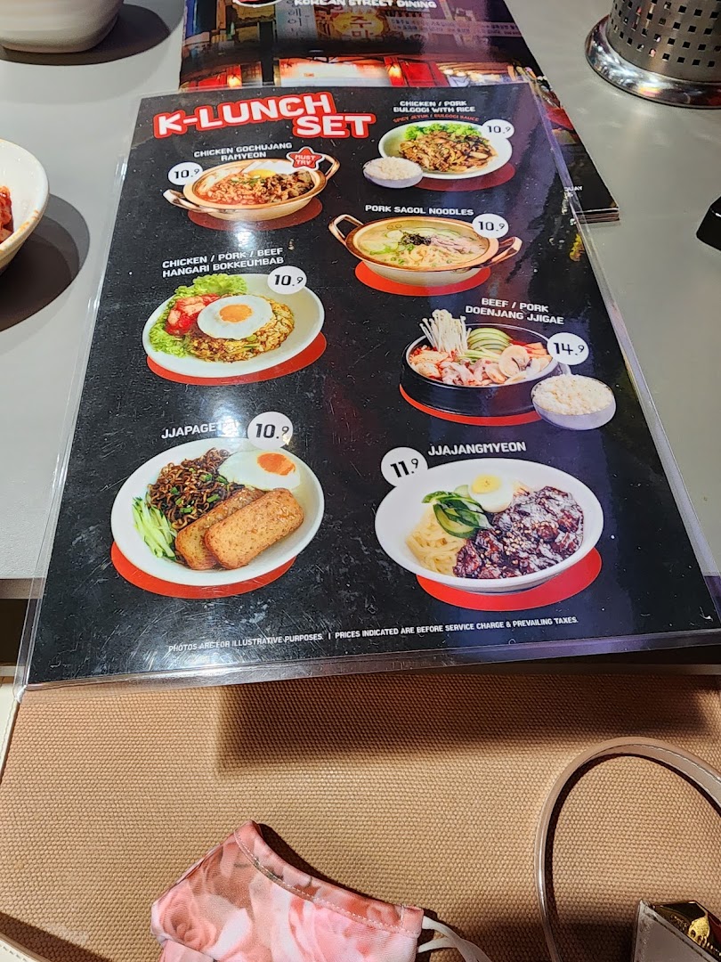 A close-up view of the 'K-LUNCH SET' menu featuring various Korean dishes with prices.
