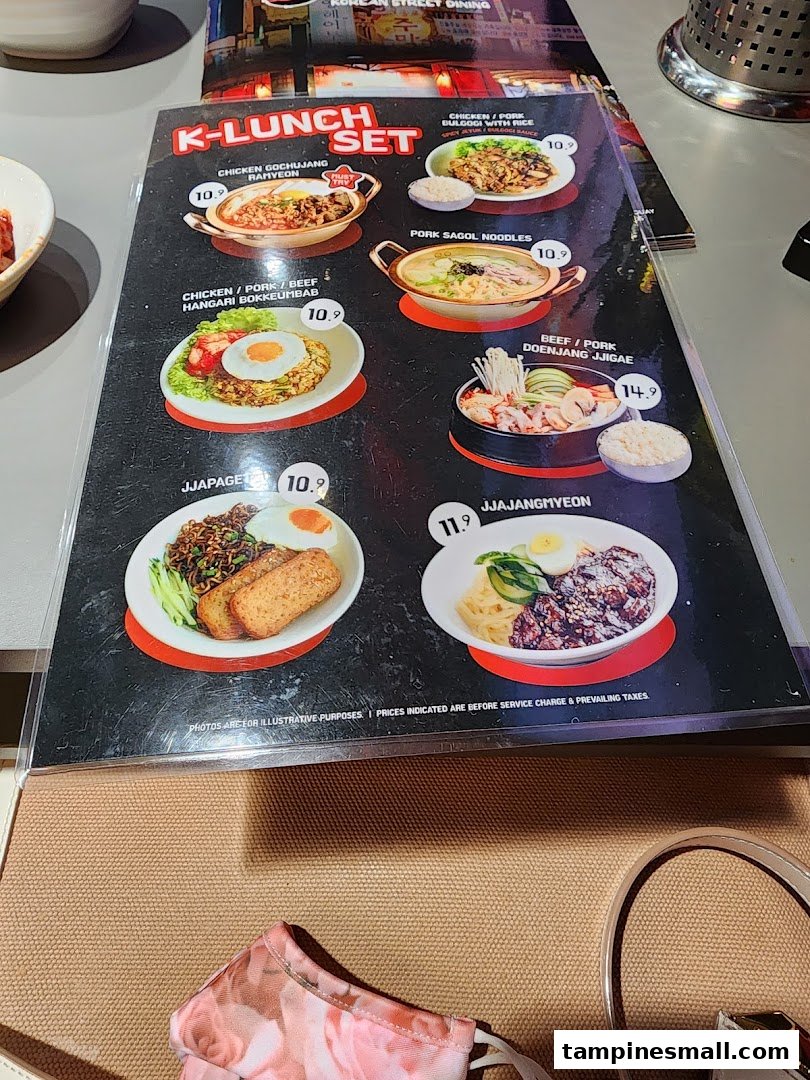 A close-up view of the 'K-LUNCH SET' menu featuring various Korean dishes with prices.