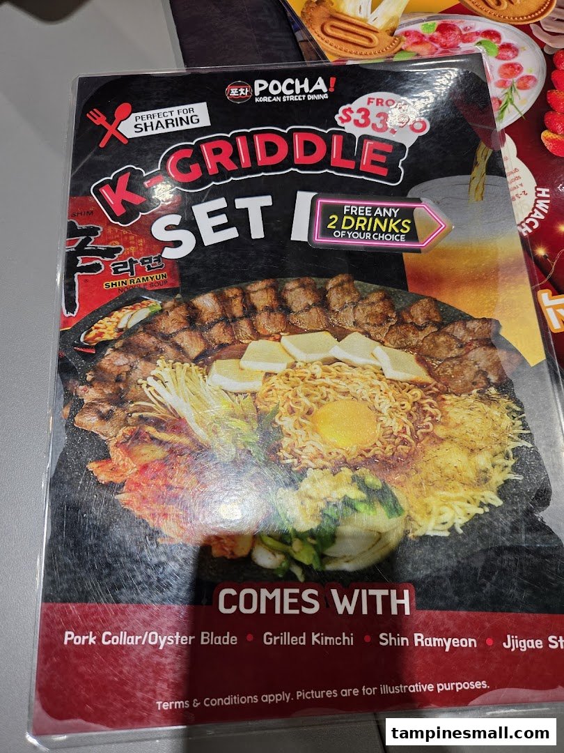 Close-up of POCHA!'s K-Griddle Set I menu page, featuring a large sharing platter and drink offer.