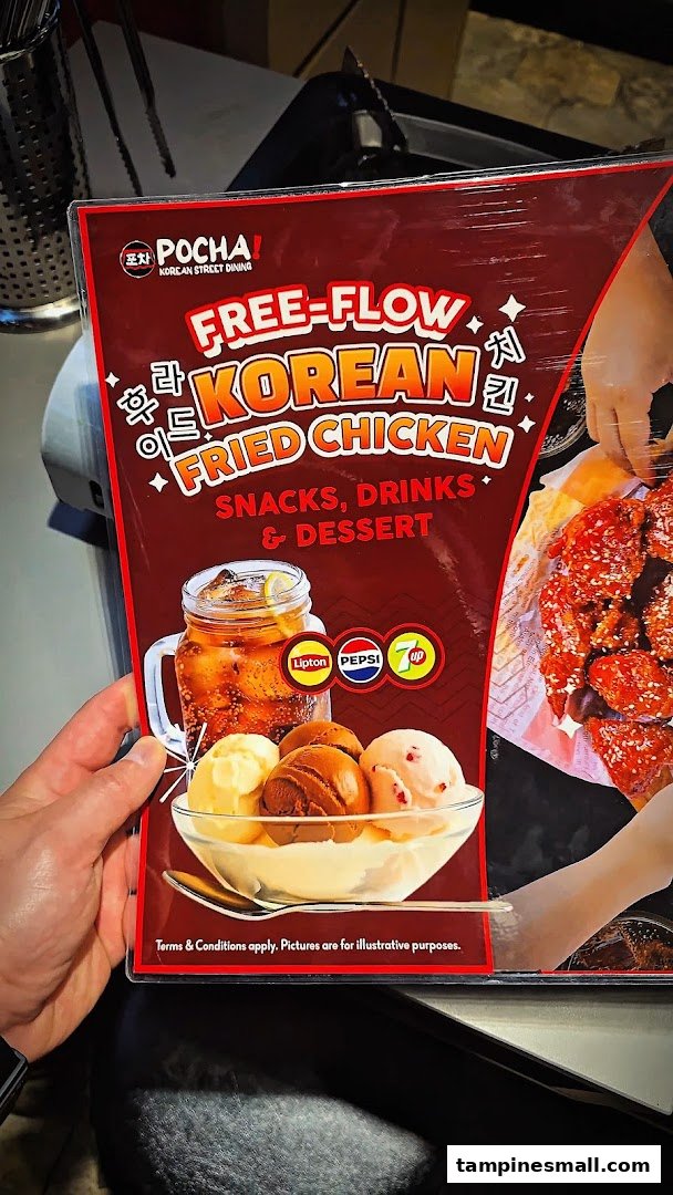 A promotional sign for POCHA! Korean Street Dining, highlighting a free-flow Korean fried chicken offer.
