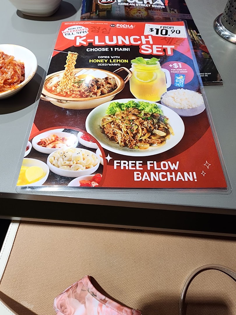 A vibrant menu showcasing POCHA!'s K-Lunch Set with main dishes, drinks, and free-flow banchan.