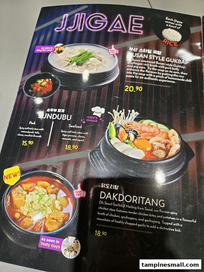 A vibrant menu page showcasing various Korean stews and hotpots with descriptions and prices.