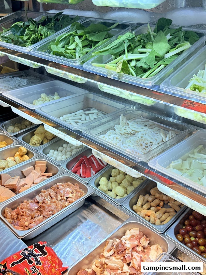A vibrant display of fresh ingredients for custom Korean street dining dishes.