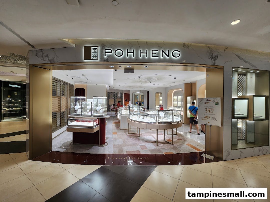 The image shows the brightly lit entrance of Poh Heng Jewellery, displaying various sparkling jewelry pieces in elegant showcases.