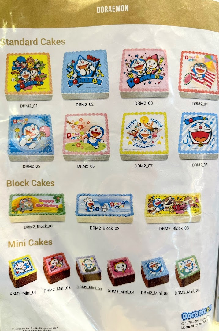 A catalog page showcasing various Doraemon-themed cakes, including standard, block, and mini sizes.