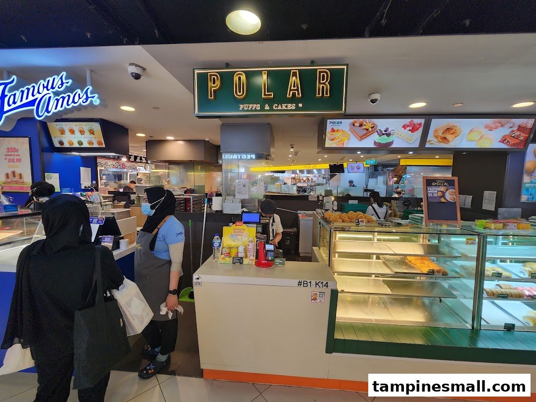 The bustling front of Polar Puffs & Cakes, showcasing fresh pastries and a welcoming counter area.