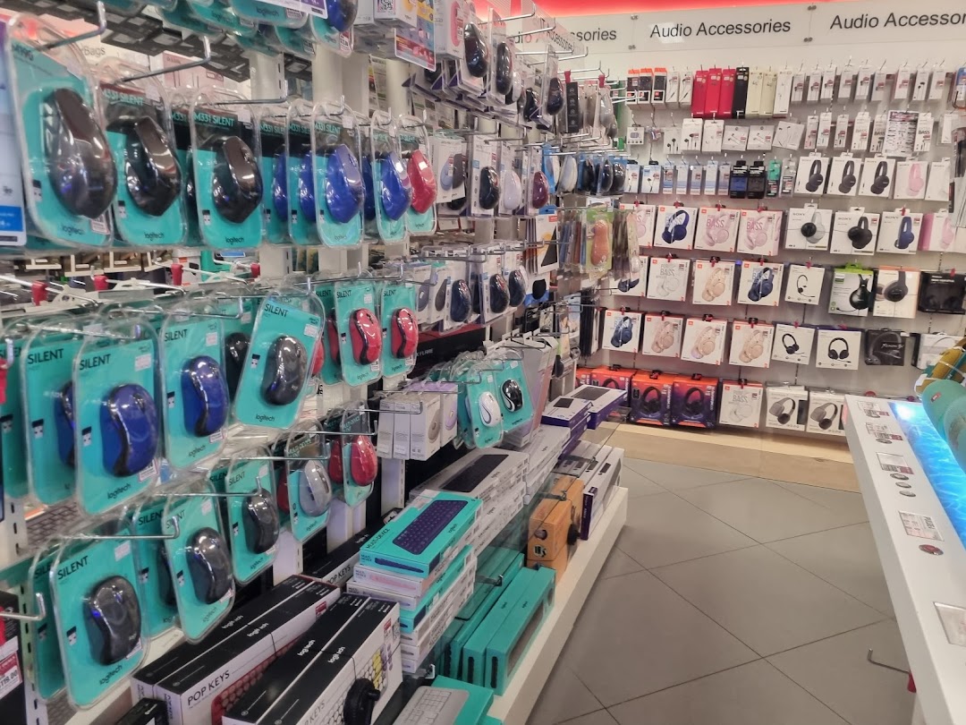 Rows of computer mice, keyboards, and audio accessories displayed in a retail store.