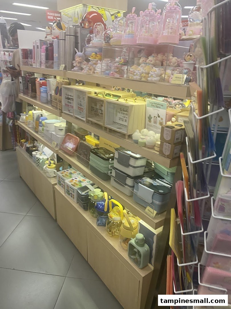 Shelves displaying a wide array of stationery, gifts, and lifestyle products within a bookstore.