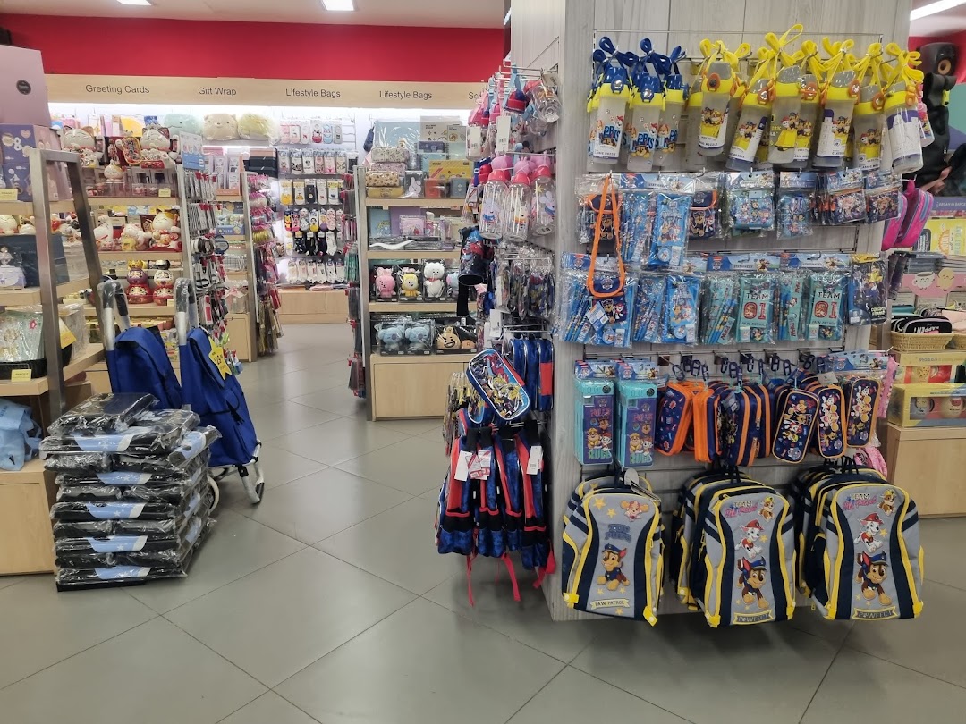 An aisle inside POPULAR Bookstore featuring school supplies, stationery, gifts, and lifestyle items.