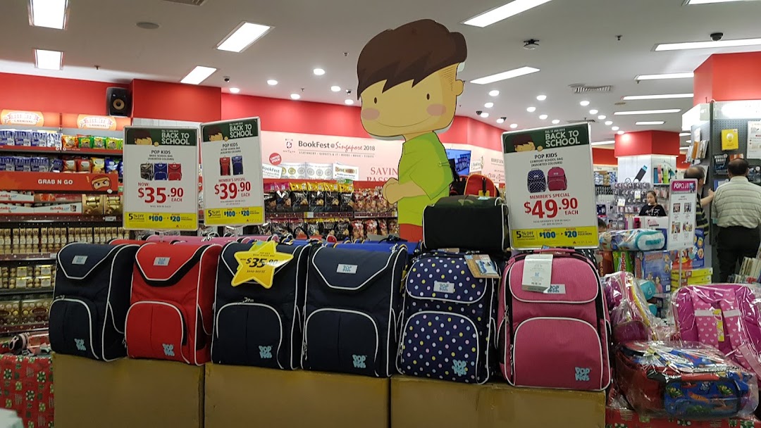 An interior shot of POPULAR Bookstore featuring a 'Back to School' display of children's backpacks.