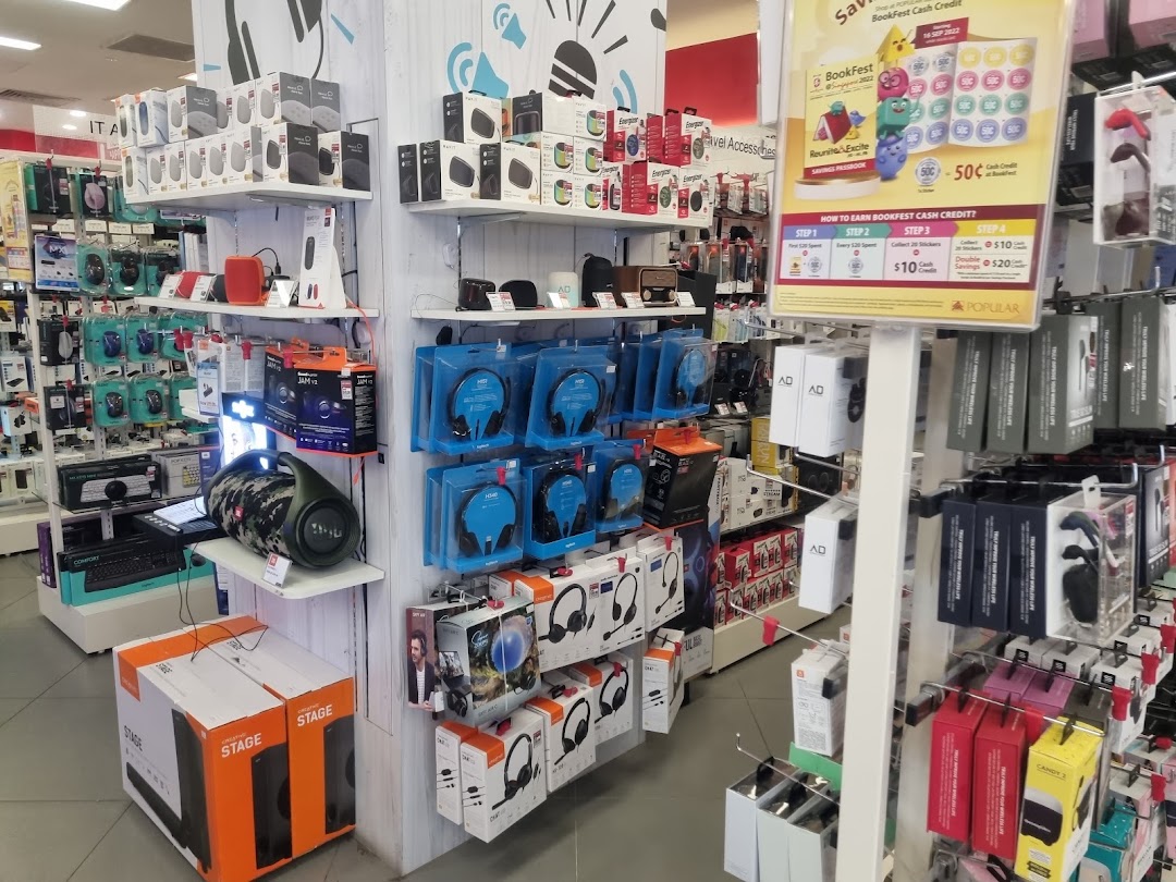 An interior view of POPULAR Bookstore showcasing a wide range of electronics and tech accessories.