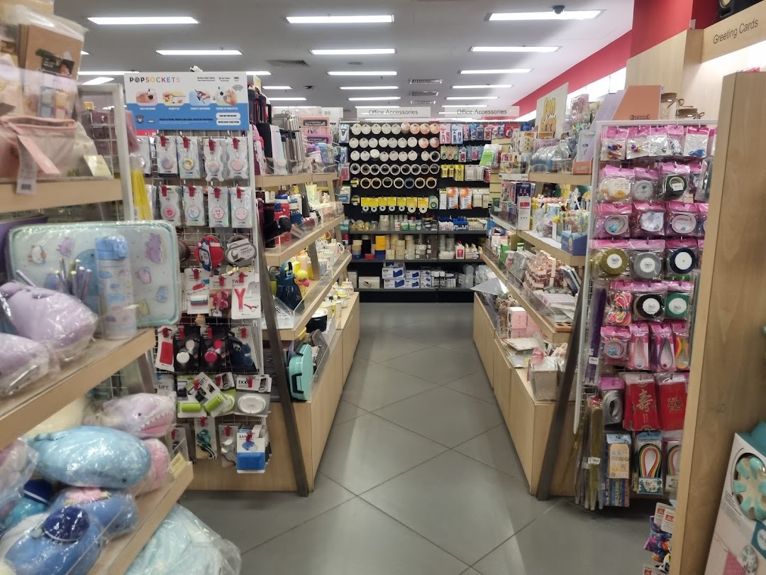 Interior view of POPULAR Bookstore, featuring aisles stocked with books, stationery, and accessories.
