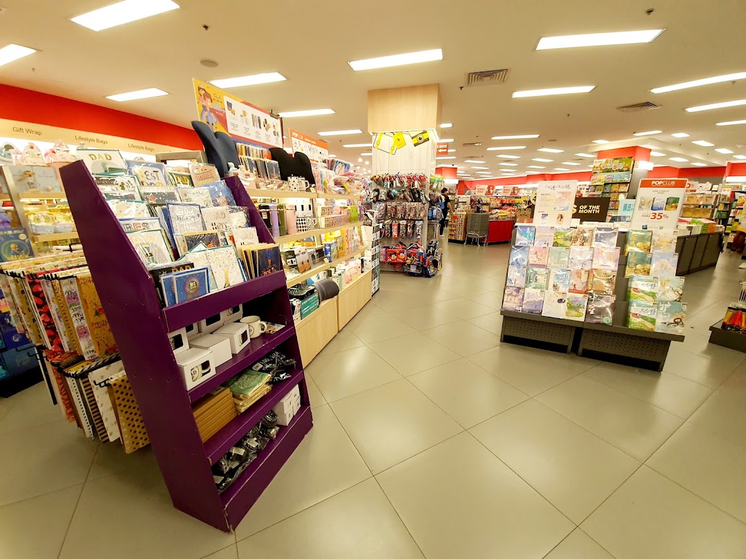 Interior view of POPULAR Bookstore with displays of books, stationery, and gift items.