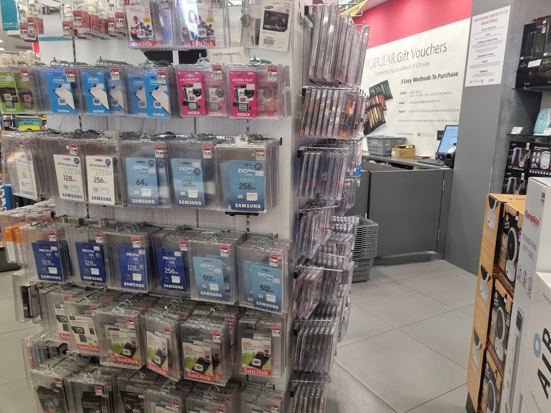 Interior of Popular Bookstore displaying a wide selection of memory cards and digital accessories near the checkout.