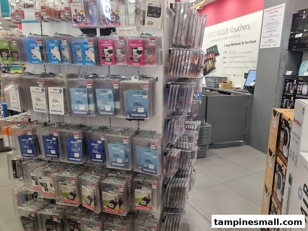Interior of Popular Bookstore displaying a wide selection of memory cards and digital accessories near the checkout.