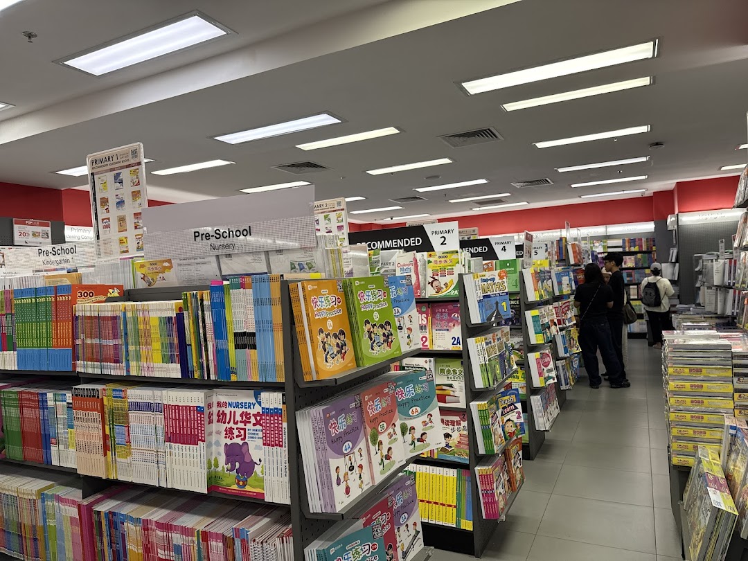 An interior view of POPULAR Bookstore, showcasing shelves filled with educational books and stationery.