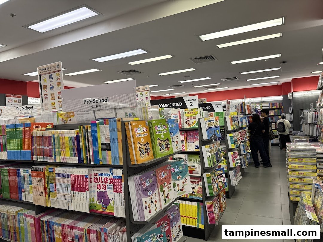 An interior view of POPULAR Bookstore, showcasing shelves filled with educational books and stationery.