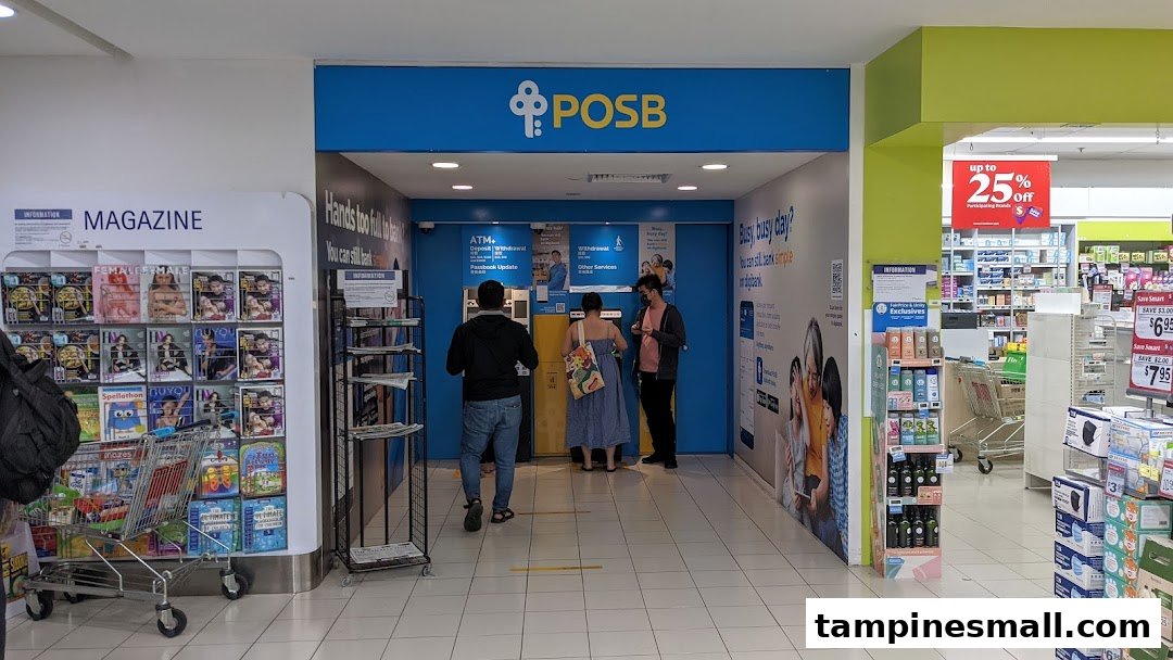 Customers utilize the POSB ATM and banking services area inside a bustling shopping mall.