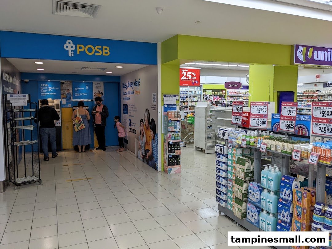 People using POSB ATMs next to a supermarket aisle with various products and promotions.