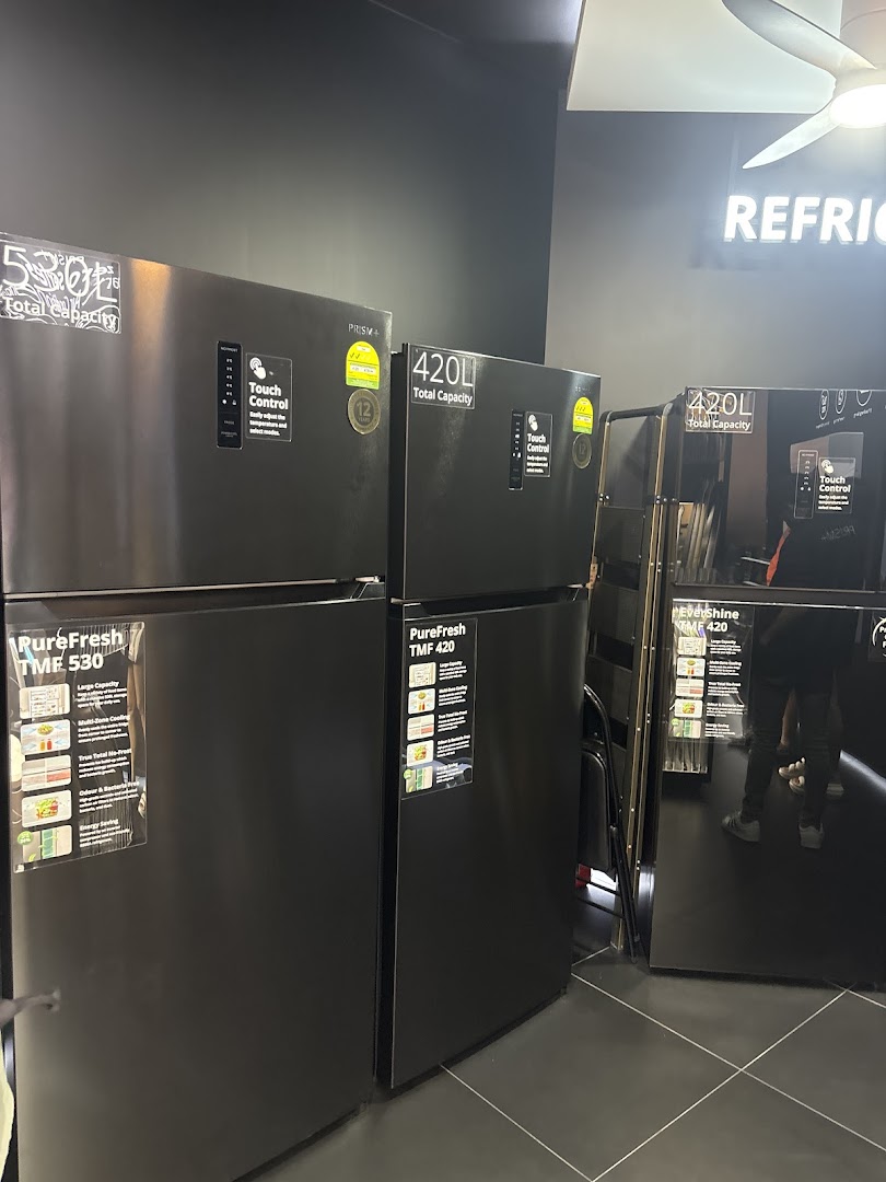 Several modern black refrigerators with touch controls and varying capacities are displayed in a retail store.