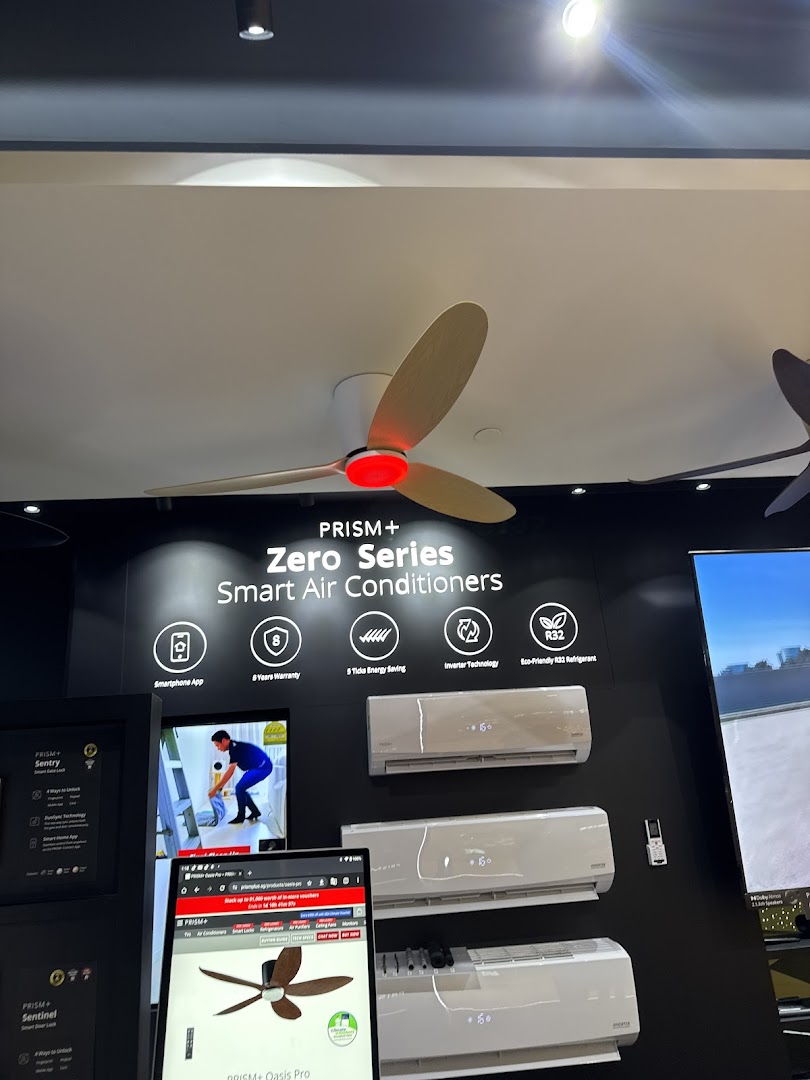 A retail display showcasing PRISM+ Zero Series smart air conditioners and a ceiling fan, with product information.