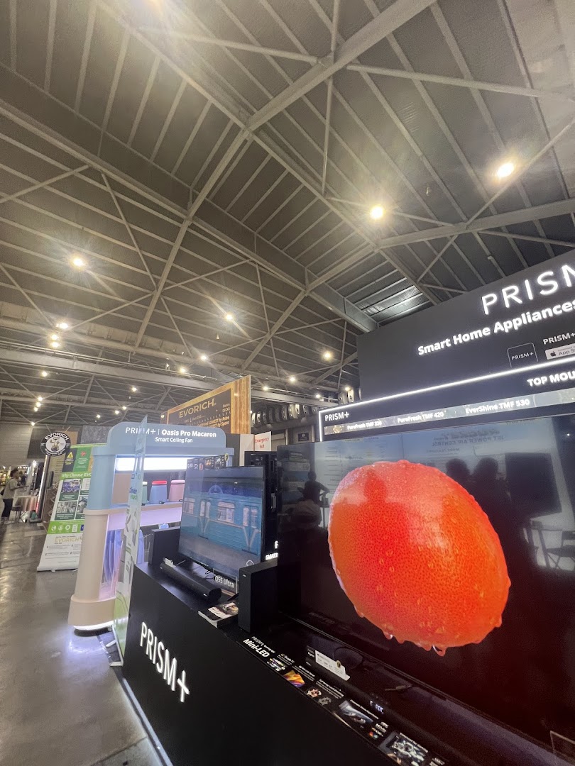 An interior view of PRISM+ showcasing smart home appliances and large screen TVs on display.