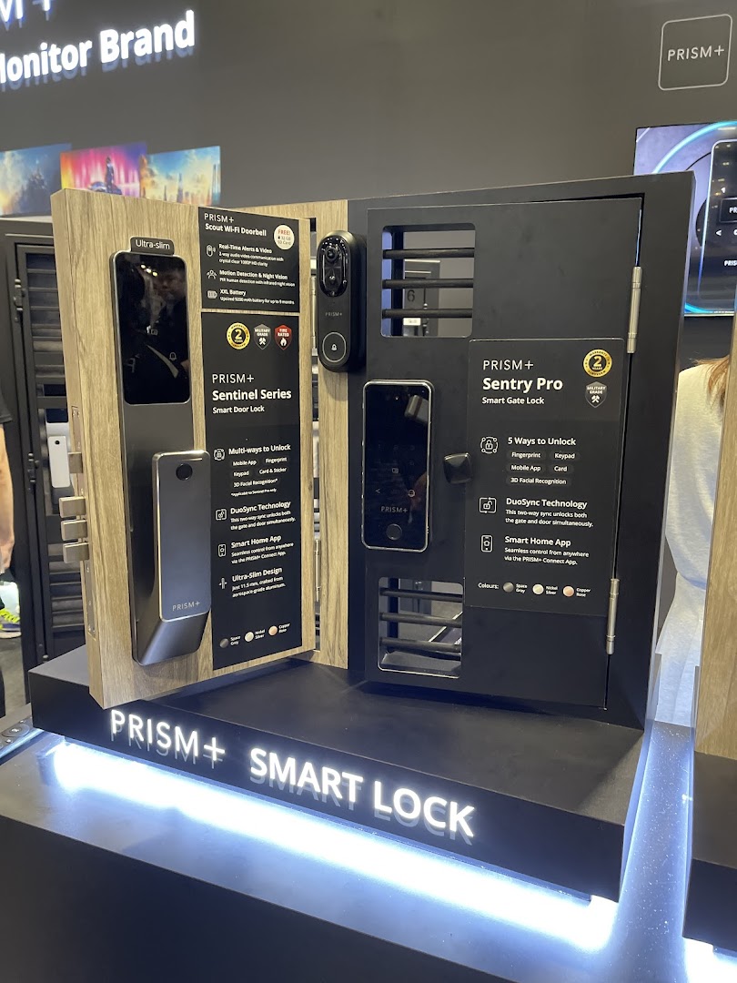 A display showcasing PRISM+ smart door locks, gate locks, and Wi-Fi doorbells with key features.