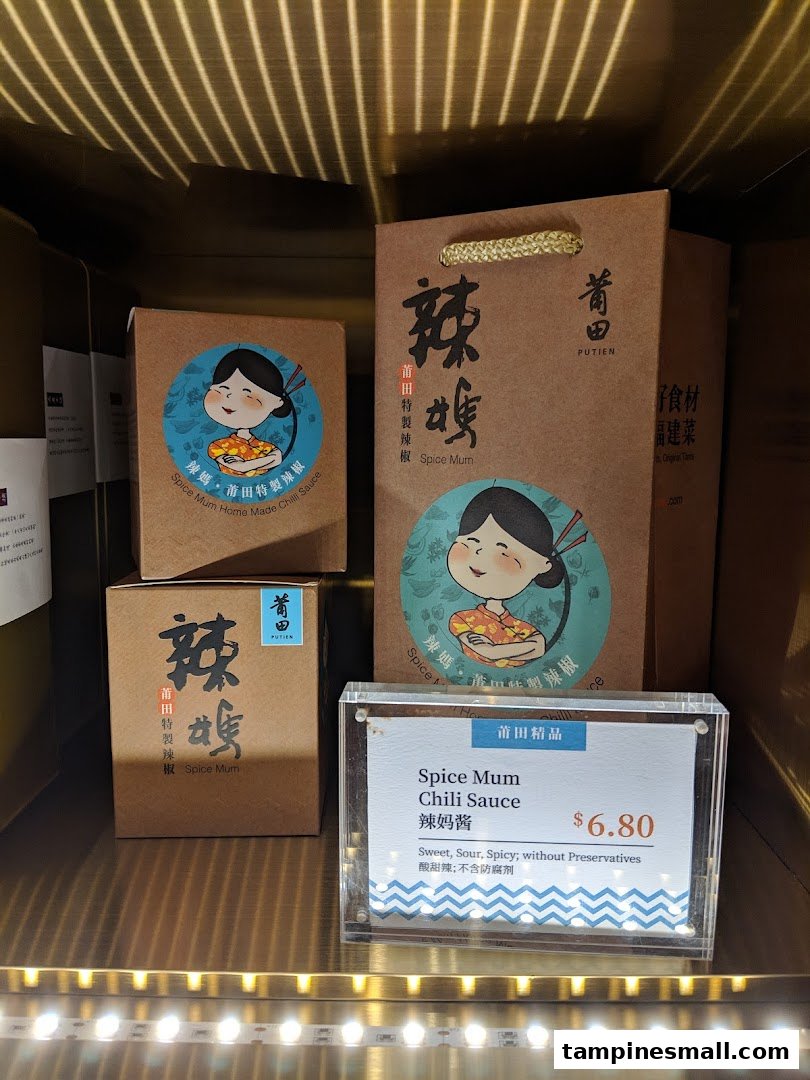 PUTIEN's 'Spice Mum Chili Sauce' products displayed with a price tag on a retail shelf.