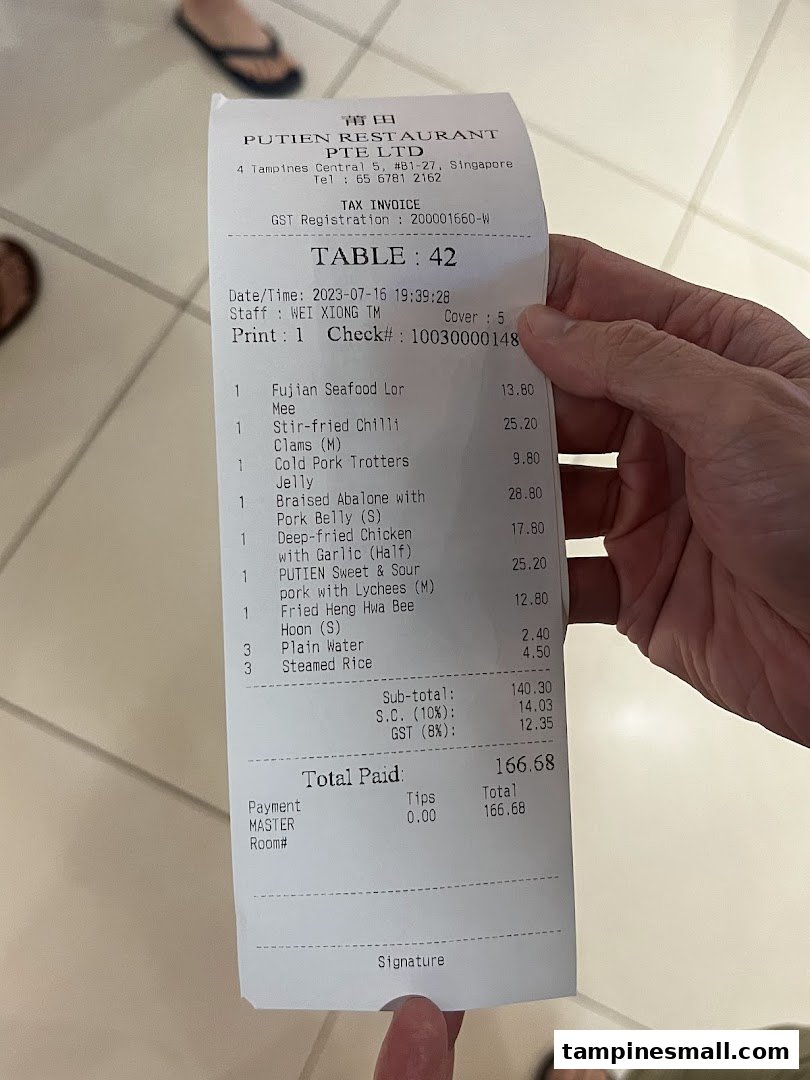 A detailed receipt from PUTIEN restaurant showing ordered dishes and total cost.