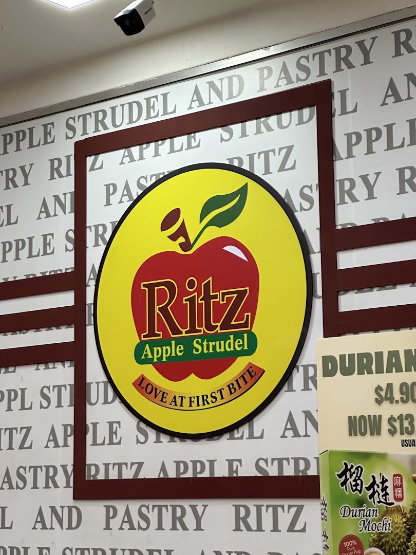 A close-up of the vibrant Ritz Apple Strudel logo and shop branding.