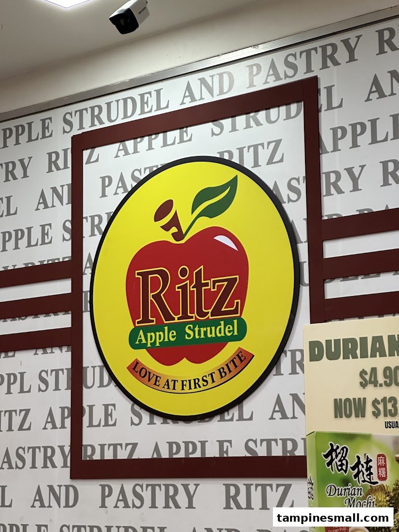 A close-up of the vibrant Ritz Apple Strudel logo and shop branding.