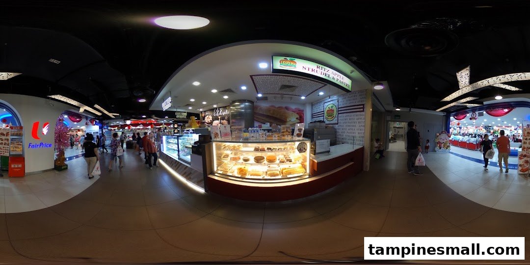 A panoramic view of Ritz Apple Strudel's display counter within a bustling mall environment.