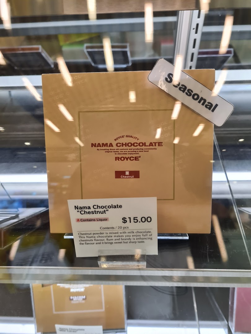 A box of Royce' Nama Chocolate 'Chestnut' flavor with product details and price.
