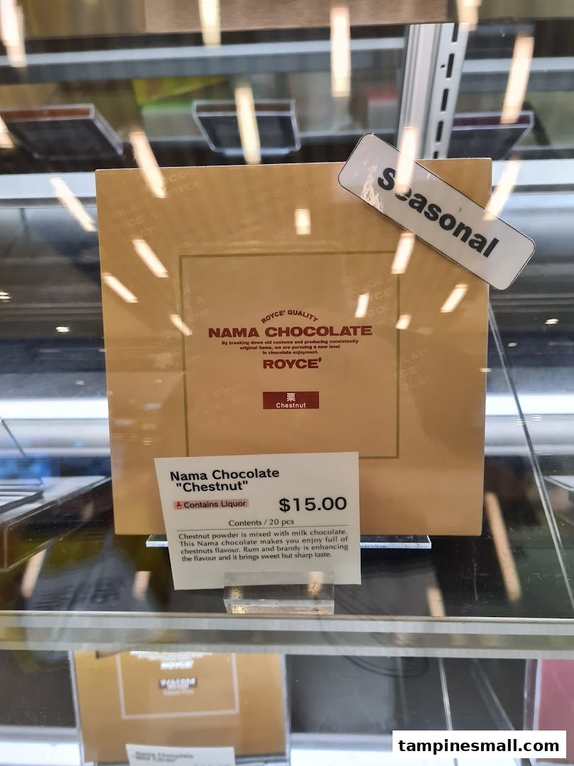 A box of Royce' Nama Chocolate 'Chestnut' flavor with product details and price.