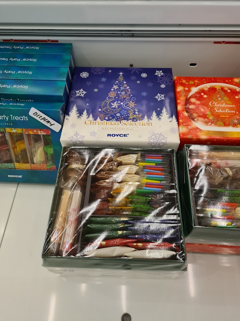 Royce chocolate gift boxes, including Christmas Selection, displayed in a retail setting.