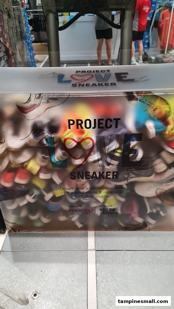 A 'Project Love Sneaker' donation box at Running Lab, encouraging shoe donations for a good cause.