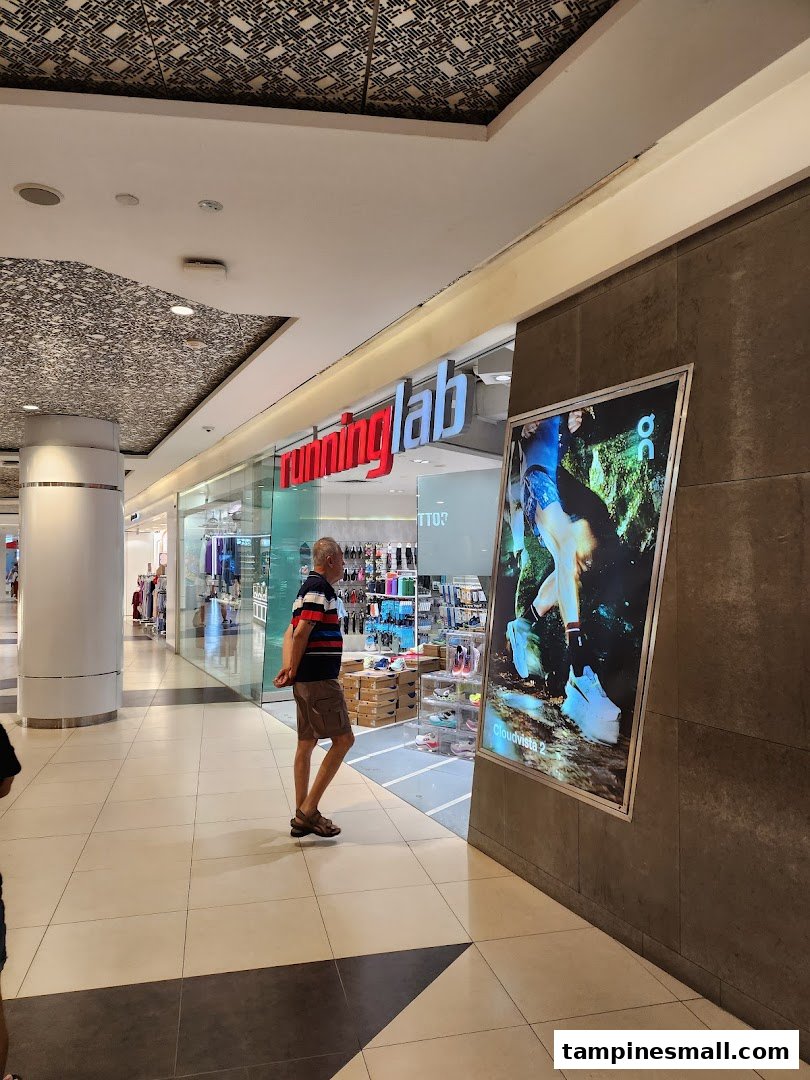 The storefront of Running Lab, a specialty running store, with a large display ad.