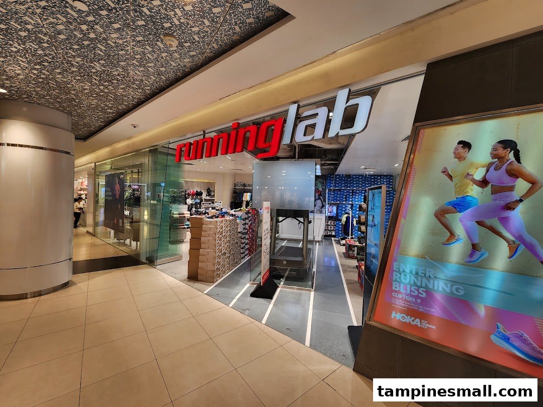 The storefront of Running Lab Tampines, featuring its logo and a large Hoka running shoe advertisement.