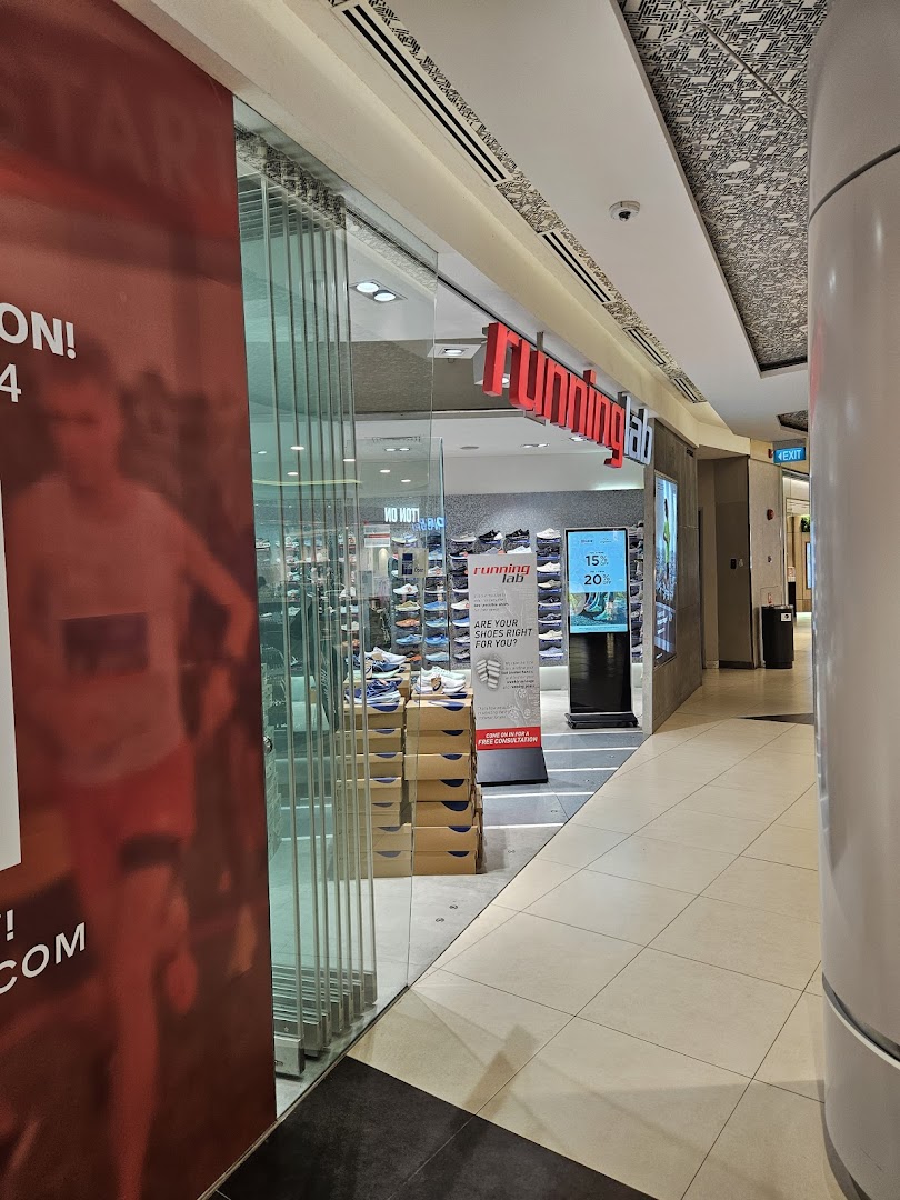The entrance of Running Lab Tampines, a specialty running shoe store, with visible displays.