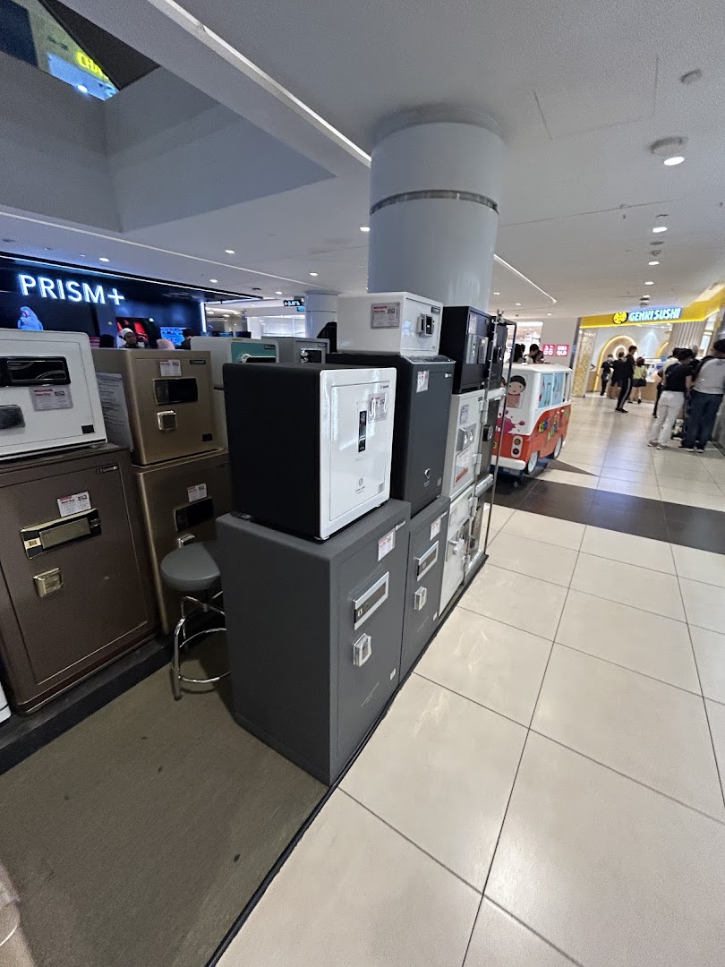 A display of various safes and security boxes inside the Safewell store.