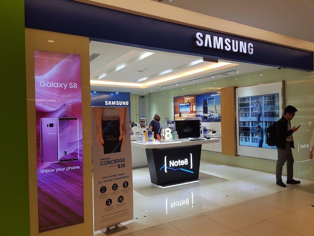 A bright, modern Samsung Experience Store entrance showcasing the latest Galaxy devices and services.