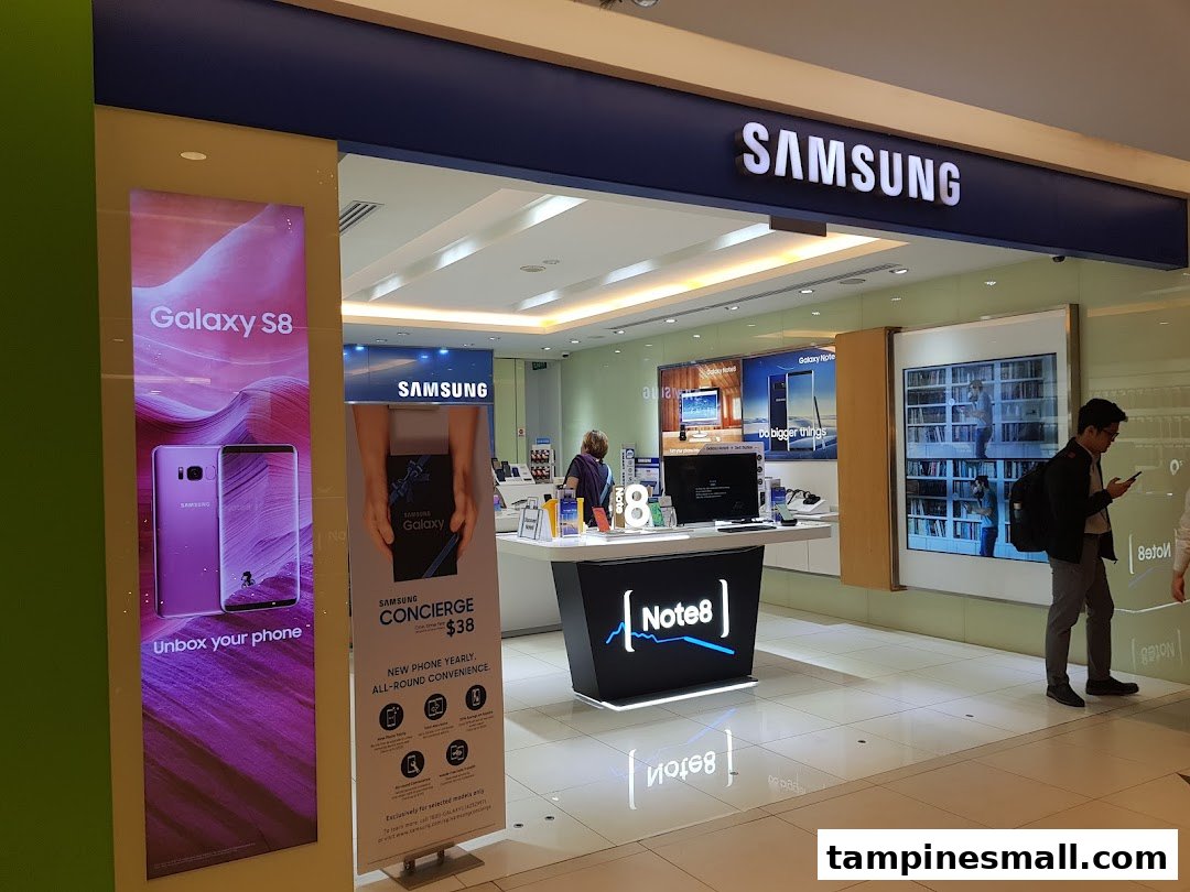 A bright, modern Samsung Experience Store entrance showcasing the latest Galaxy devices and services.