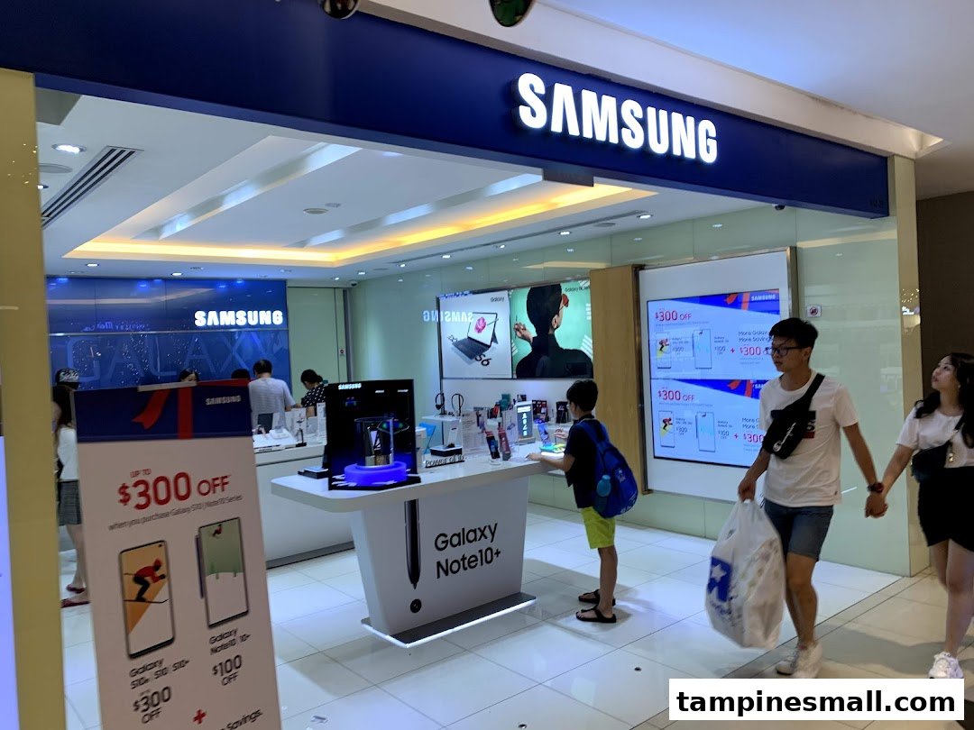 Inside the Samsung Experience Store, customers explore the latest smartphones and electronics amidst vibrant displays and promotions.