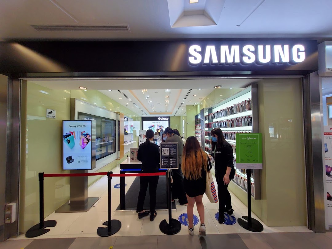 The inviting entrance of a Samsung Experience Store, showcasing new products and welcoming customers.