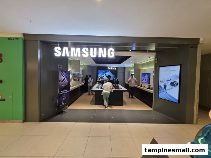 View of the Samsung Experience Store entrance with customers browsing devices and interactive displays inside.